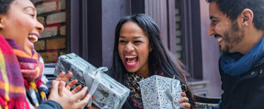 Excited young friends exchanging