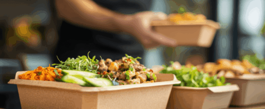 A counter with salad kits in zero-waste, paper-based packaging